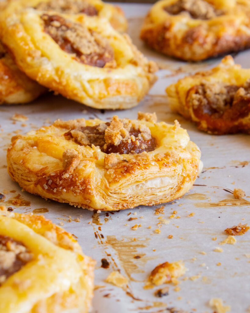 close up of puff pastry layers in Pumpkin Cream Cheese Danish