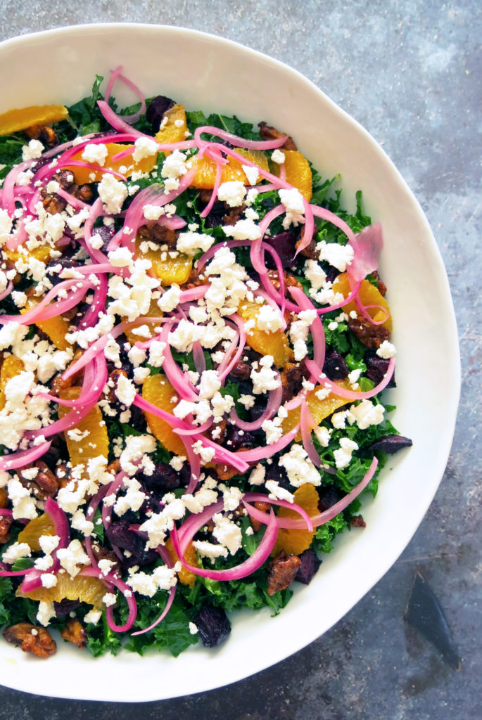half overhead shot of citrus beet & kale salad