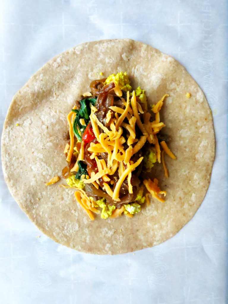 Cross section of Vegan Breakfast Burritos with cheese