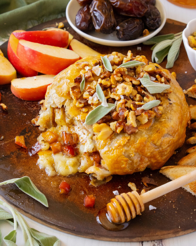 Baked Brie with Caramelized Apples with brie oozing out