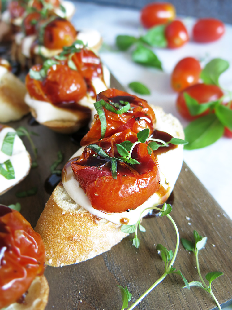 Whipped Feta and Ricotta Crostini with Roasted Tomatoes.