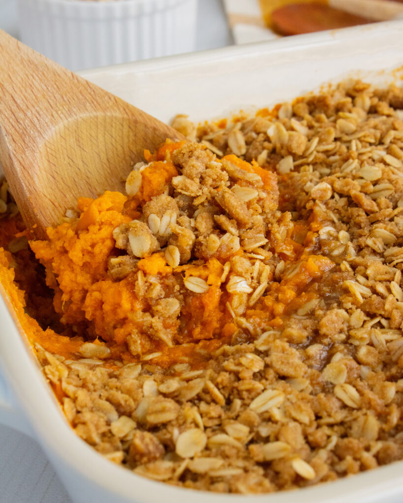 close up of scooping a spoonful of sweet potato casserole