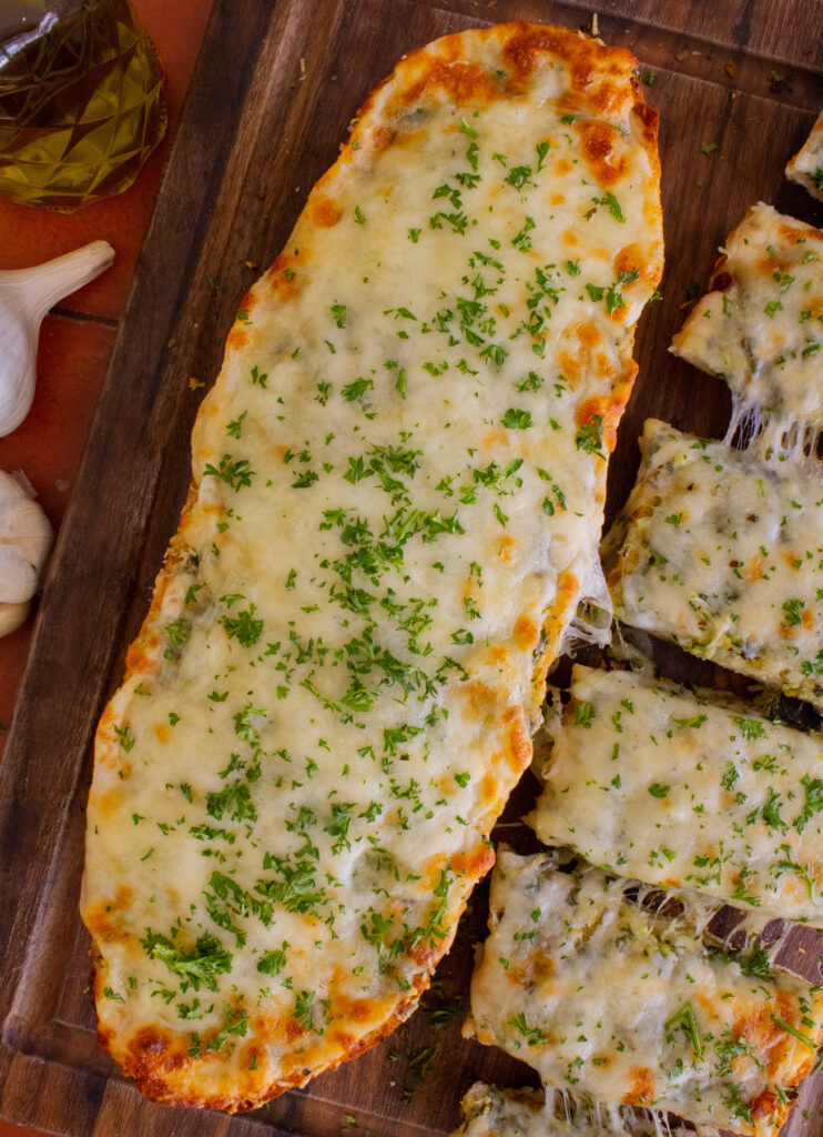 overhead shot of Cheesy Garlic Bread before it's cut into slices