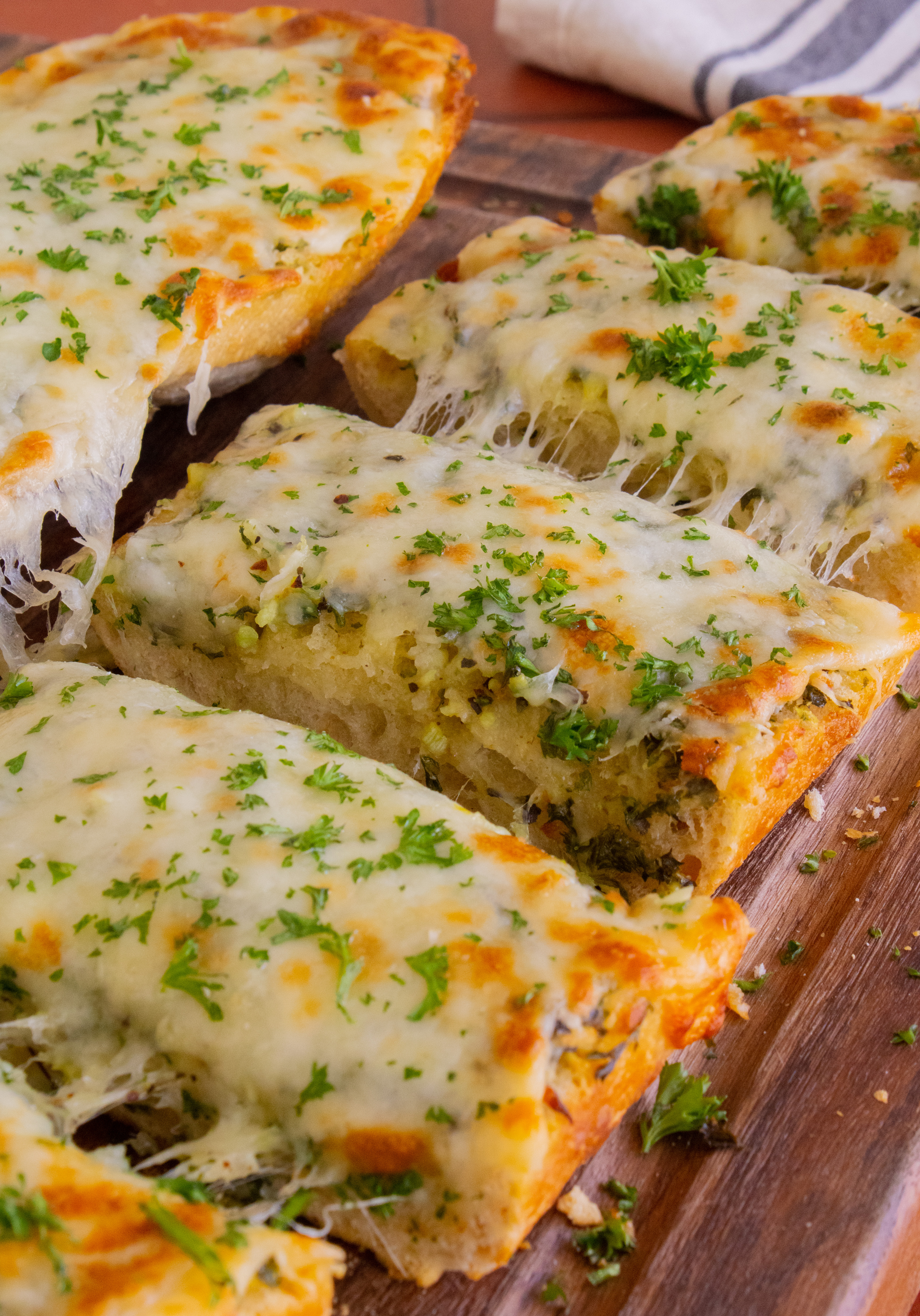 close up shot of Cheesy Garlic Bread slices