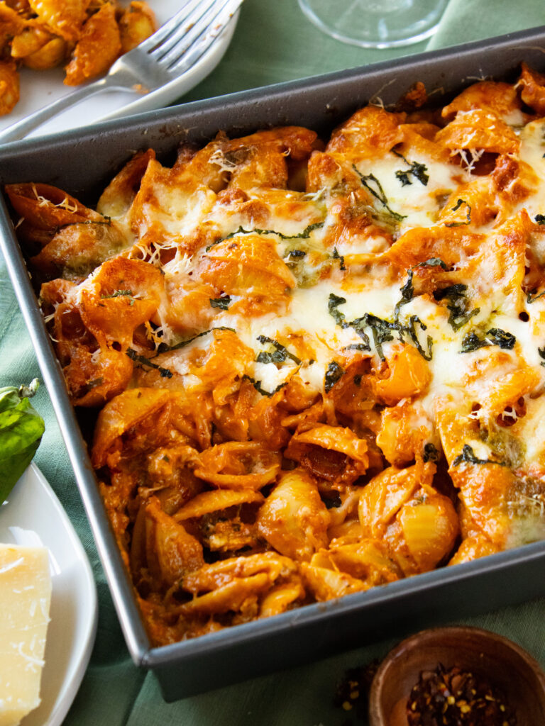 Spicy Vodka Pasta Bake with a scoop taken out of the pan