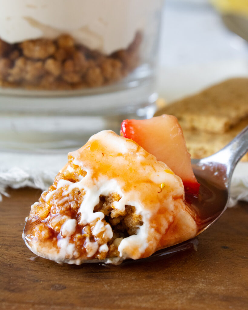 Macro shot of a spoonful of Strawberry Guava Cheesecake Parfaits