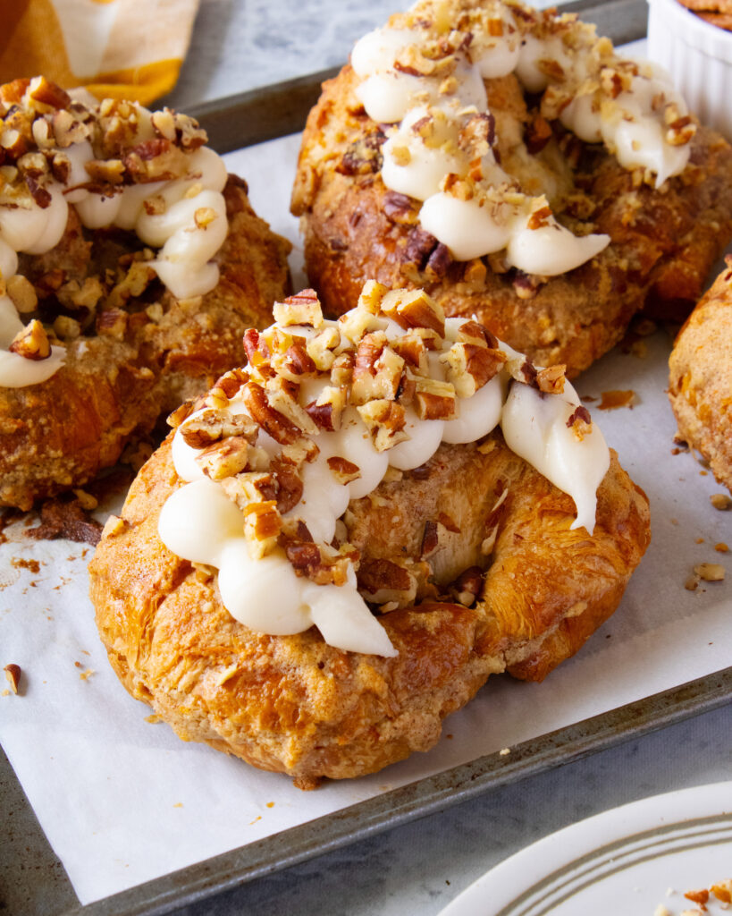carrot cake croissants on baking sheet