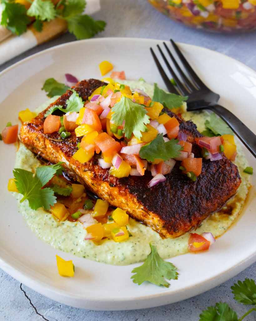 45 degree angle shot of Blackened Salmon with Tomato Relish