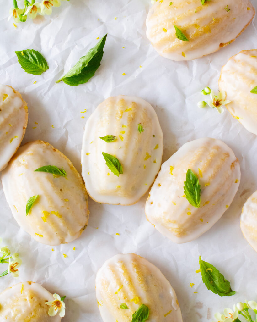 top top shot of Lemon Olive Oil Basil Madeleines styled on parchment