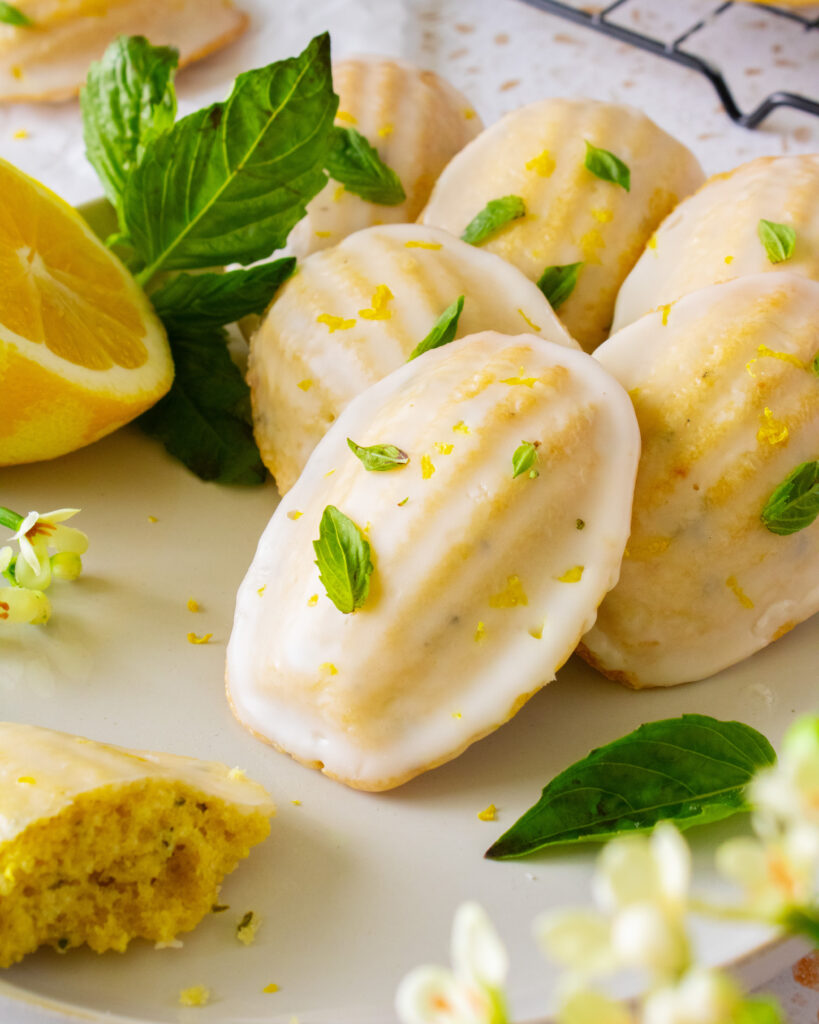 Close up of Lemon Olive Oil Basil Madeleines on a plate