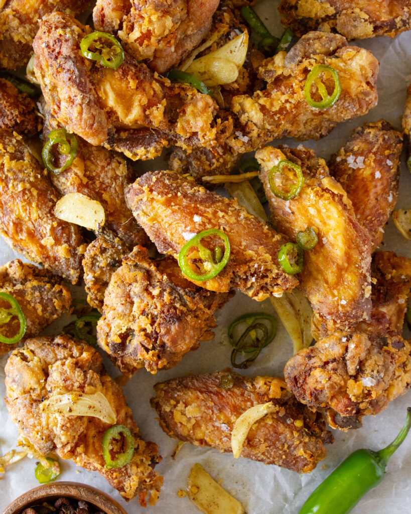 overhead shot of a pile of Salt and Pepper Chicken Wings