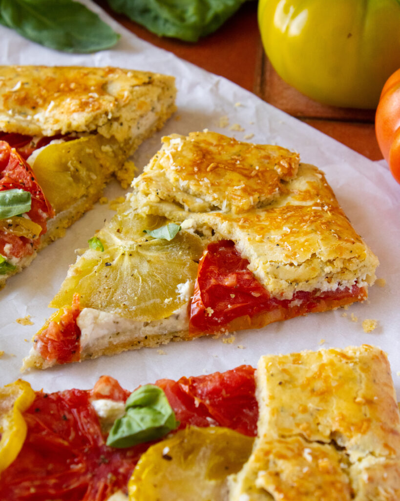 high angle of singular Heirloom Tomato and Herb Galette slice