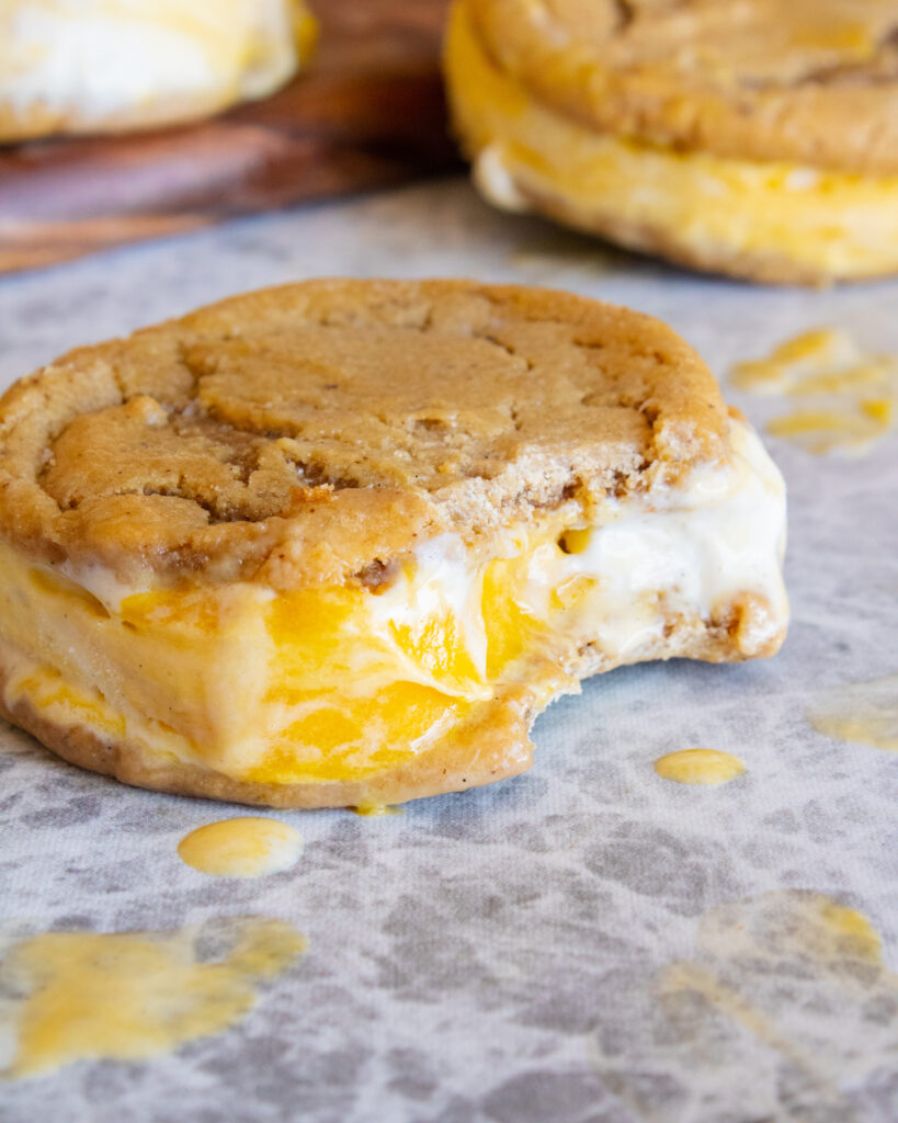 close up of Mango Creamsicle Ice Cream Sandwiches with a bite taken out