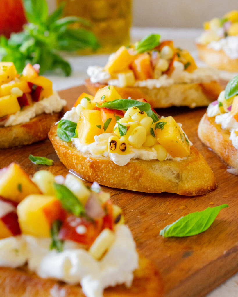 close up of Peach and Corn Burrata Crostini