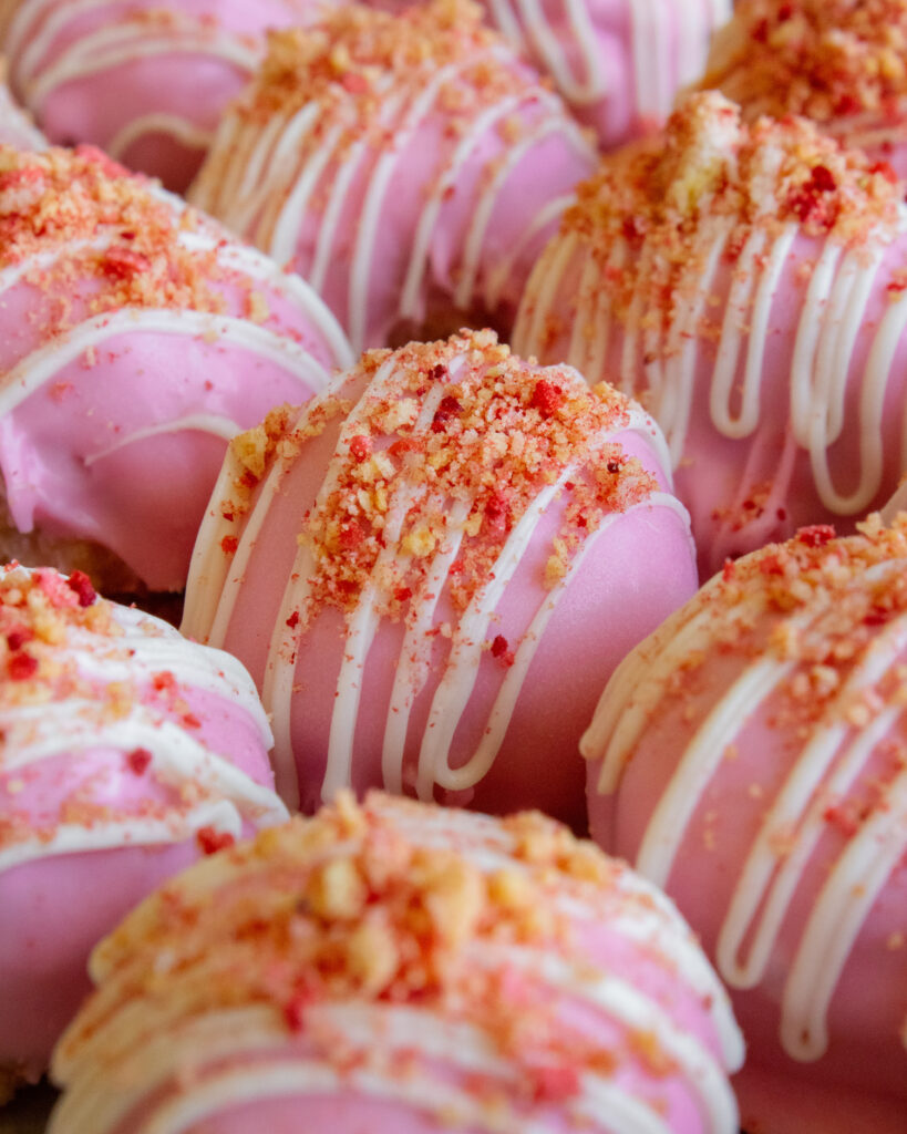 close up of Strawberry Shortcake Cheesecake Truffles crumb topping