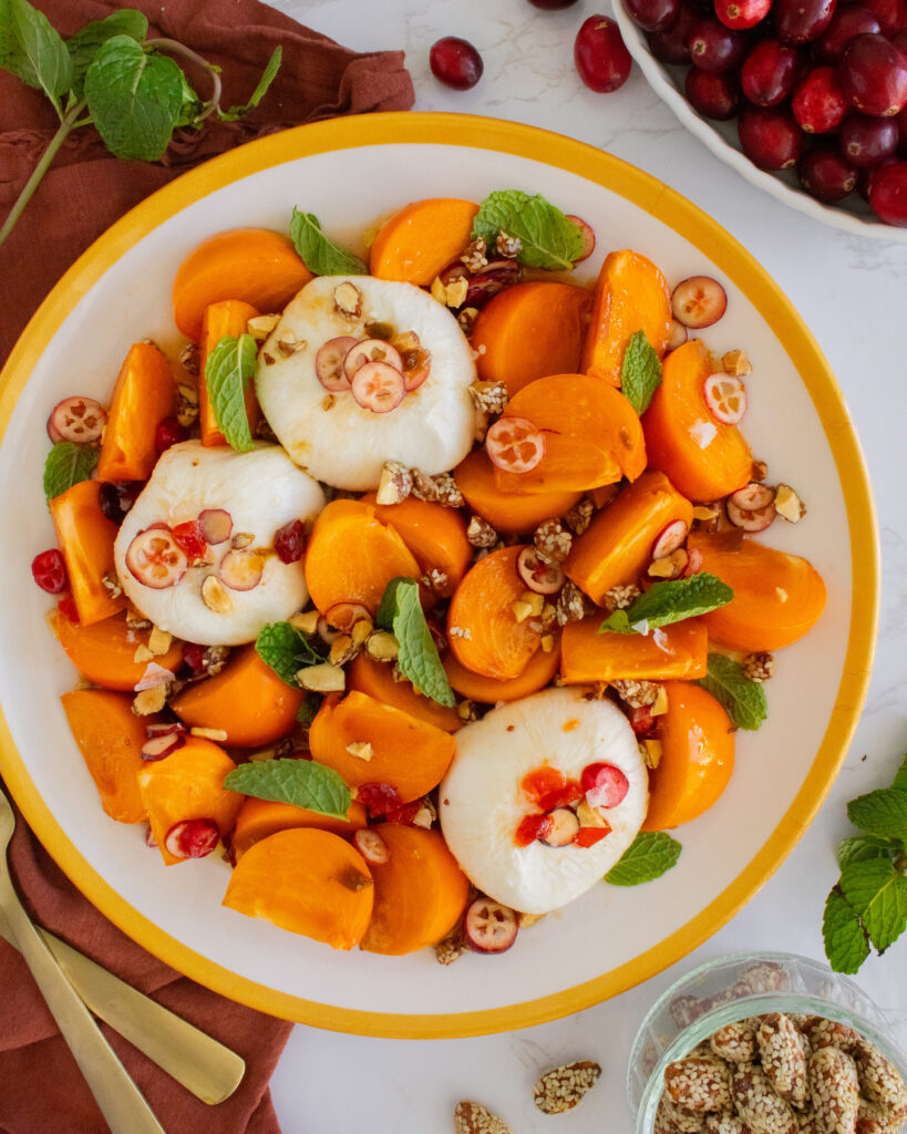 overhear shot of Persimmon Burrata Salad on a plate