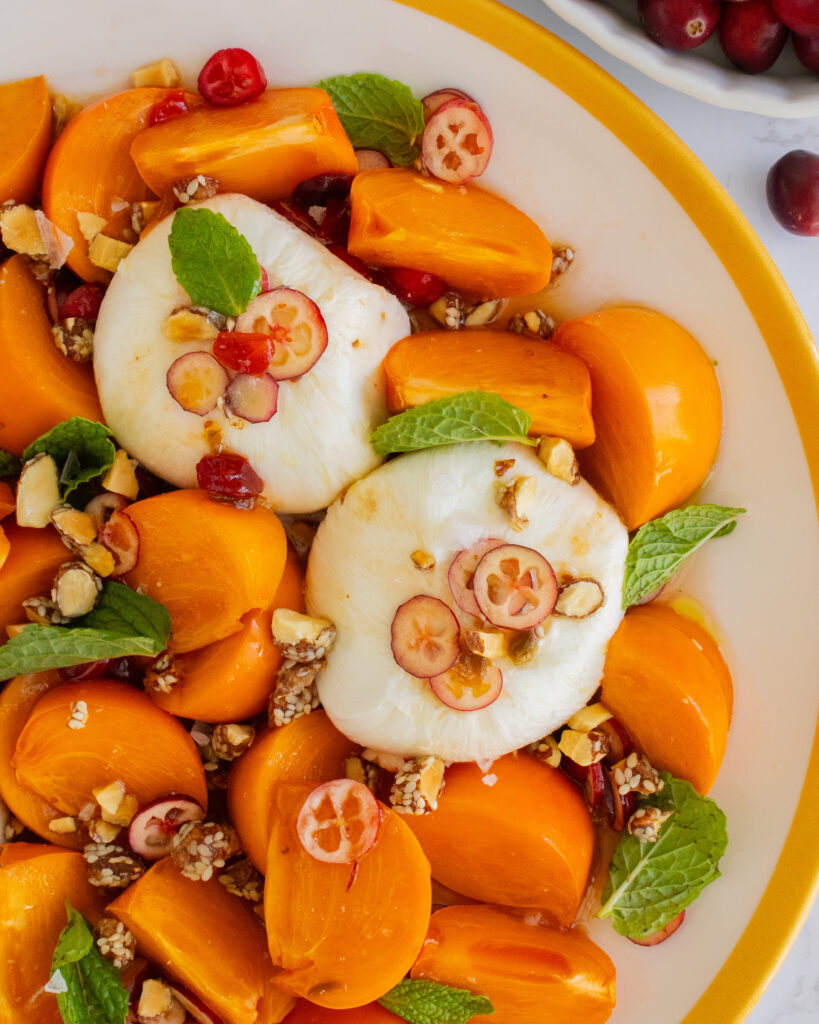 close up of burrata in Persimmon Burrata Salad
