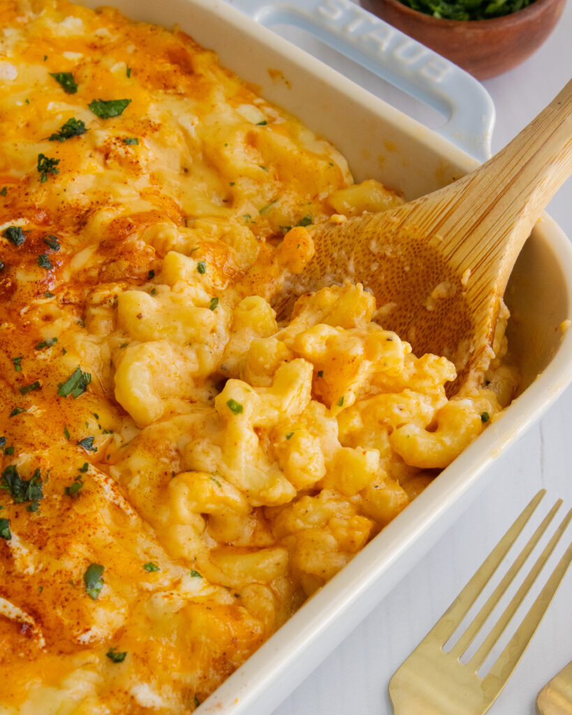 Scoop of smoked mac and cheese in baking dish