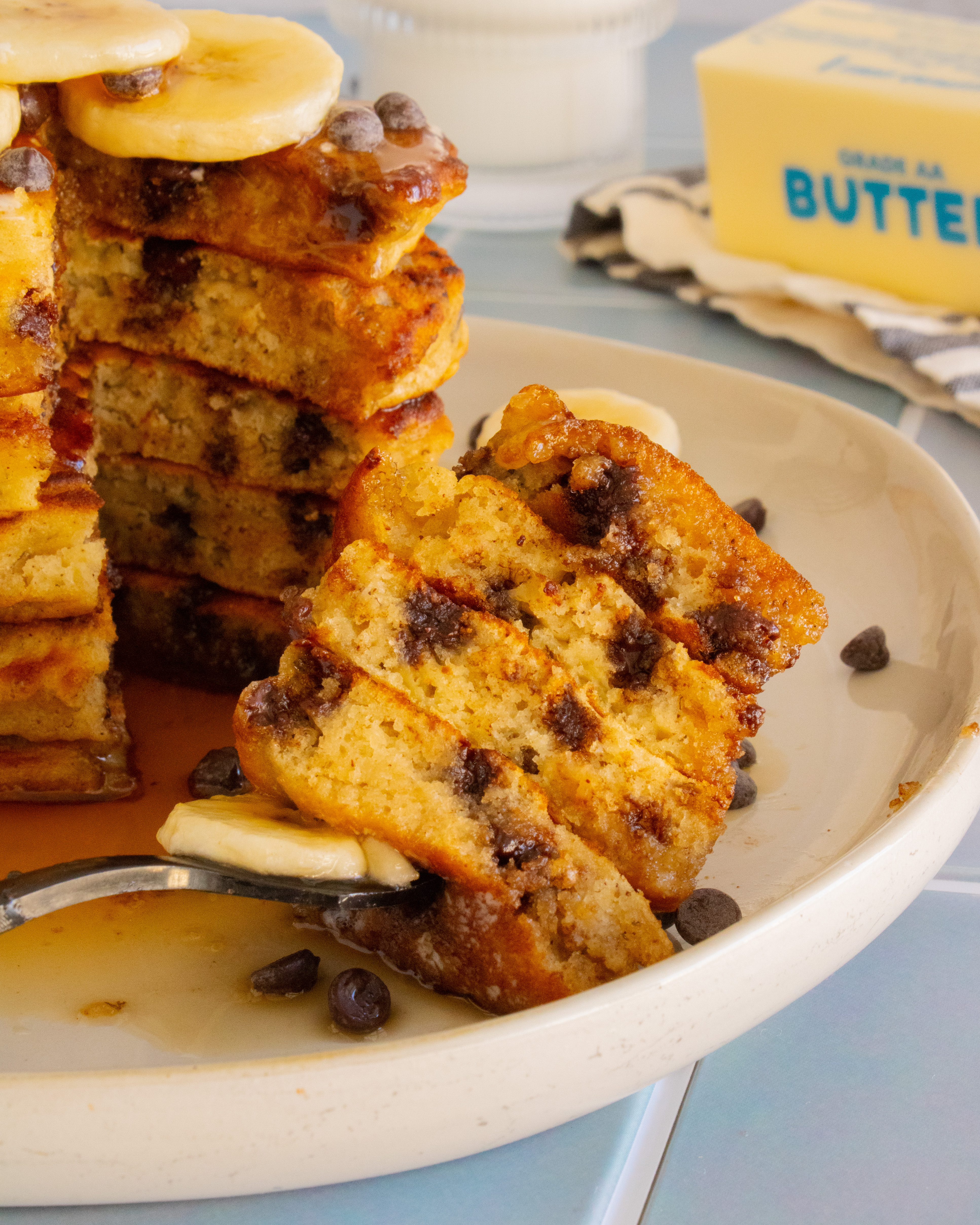close up of a bite of Chocolate Almond Banana Pancakes on a fork