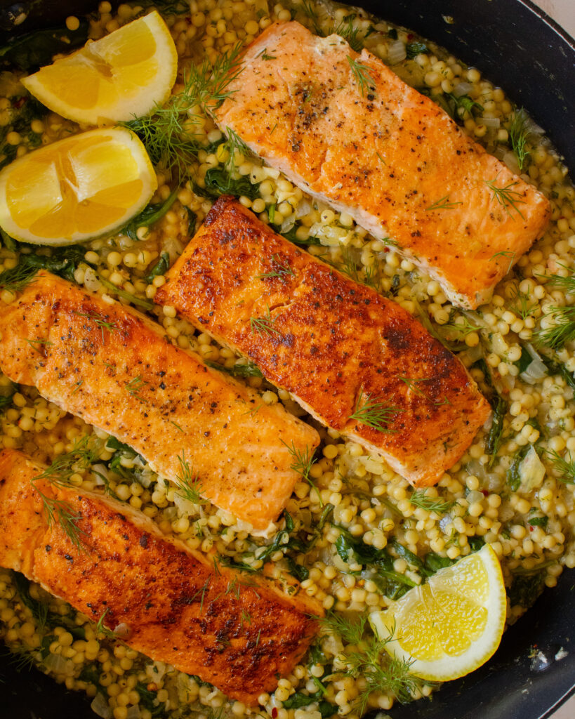overhead shot of One-Pan Herby Salmon and Couscous in the pan