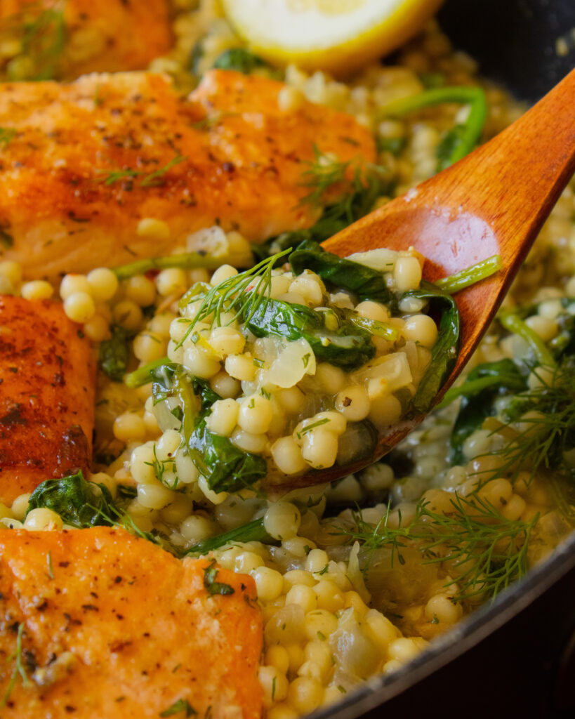 close up of One-Pan Herby Salmon and Couscous on a spoon