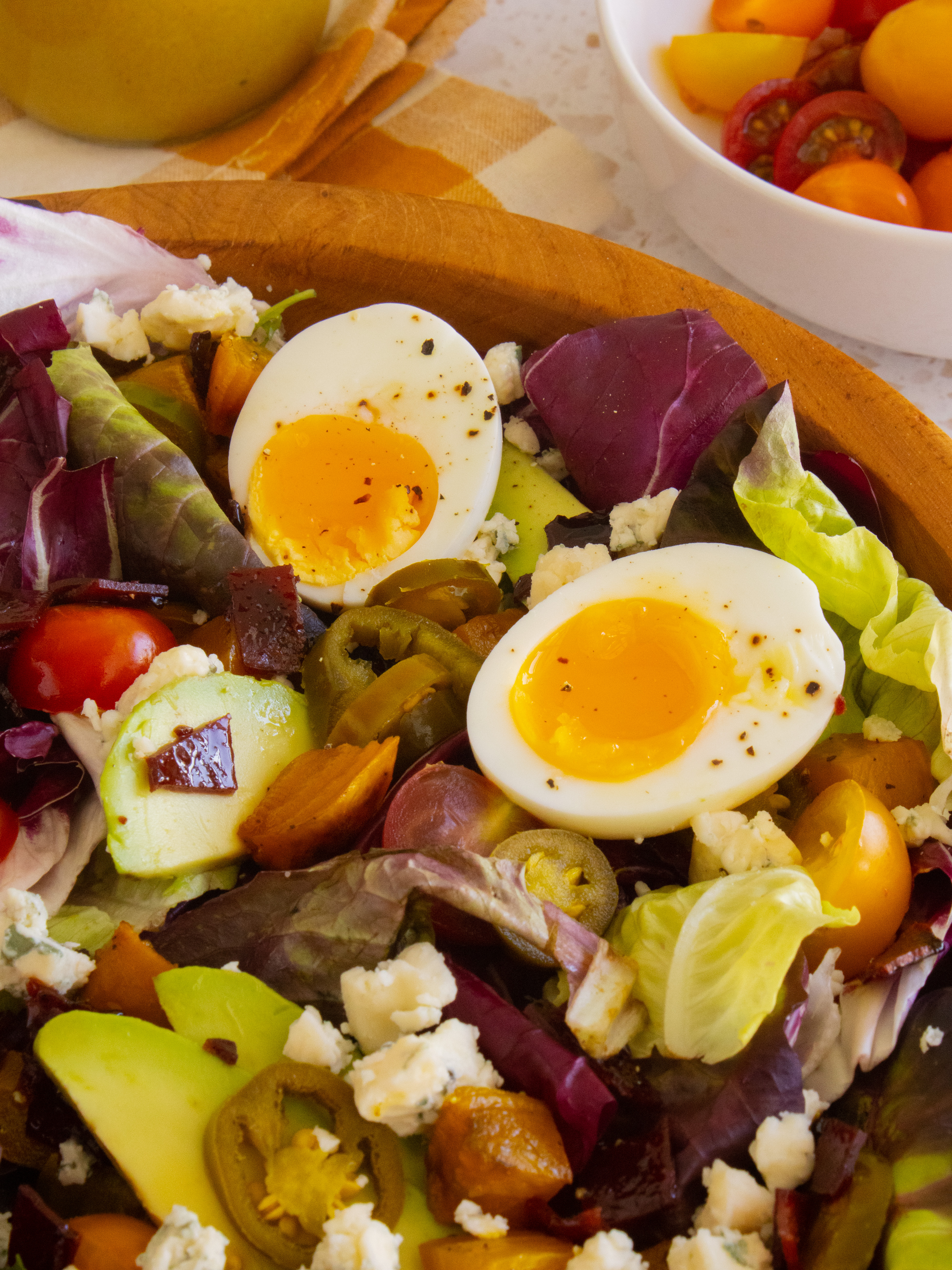 close up of jammy eggs in Copycat Goop Cobb Salad