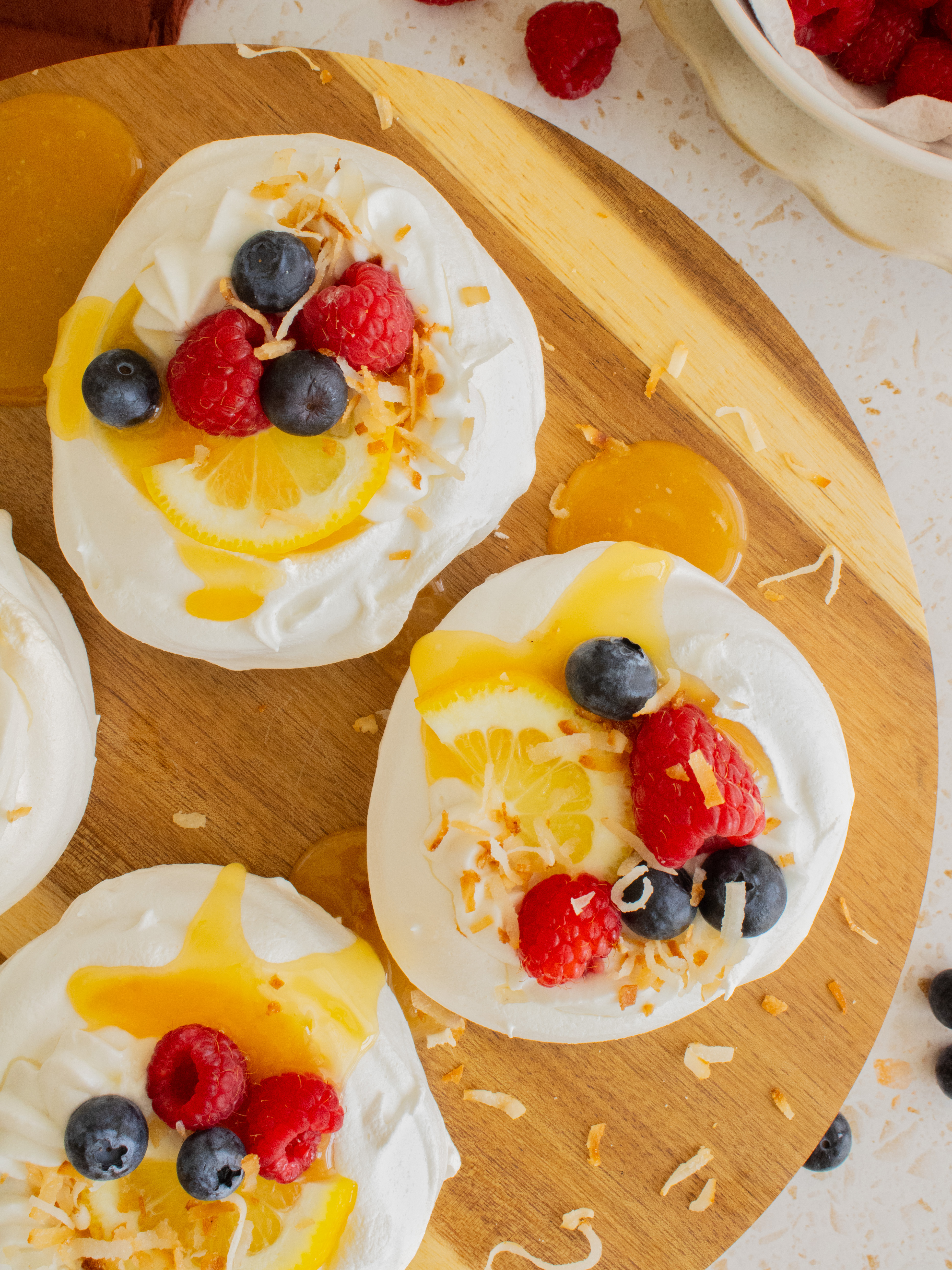 overhead close up of 2 lemon coconut mini pavlovas