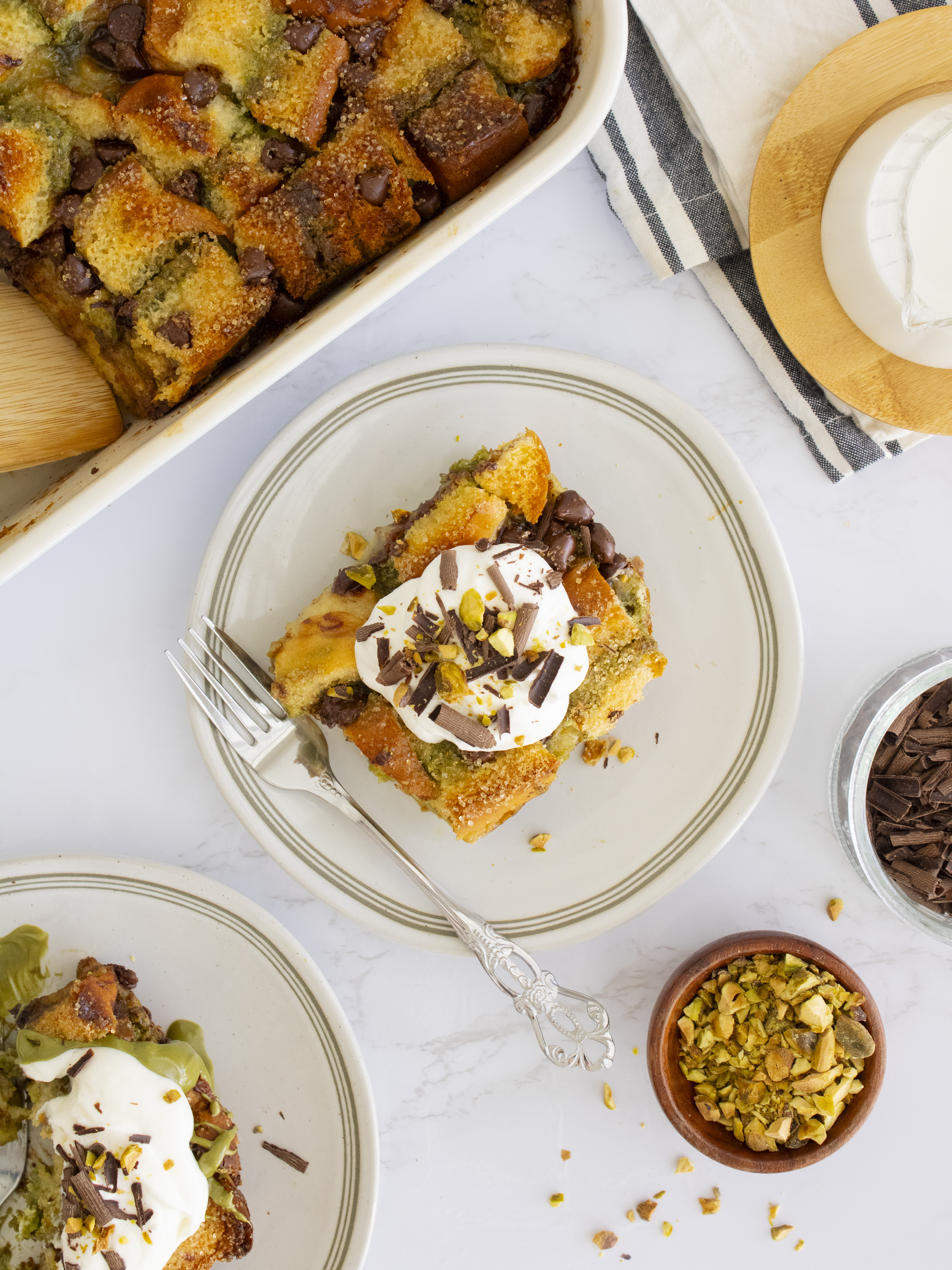 overhead shot of a slice of Pistachio Chocolate Bread Pudding on a plate