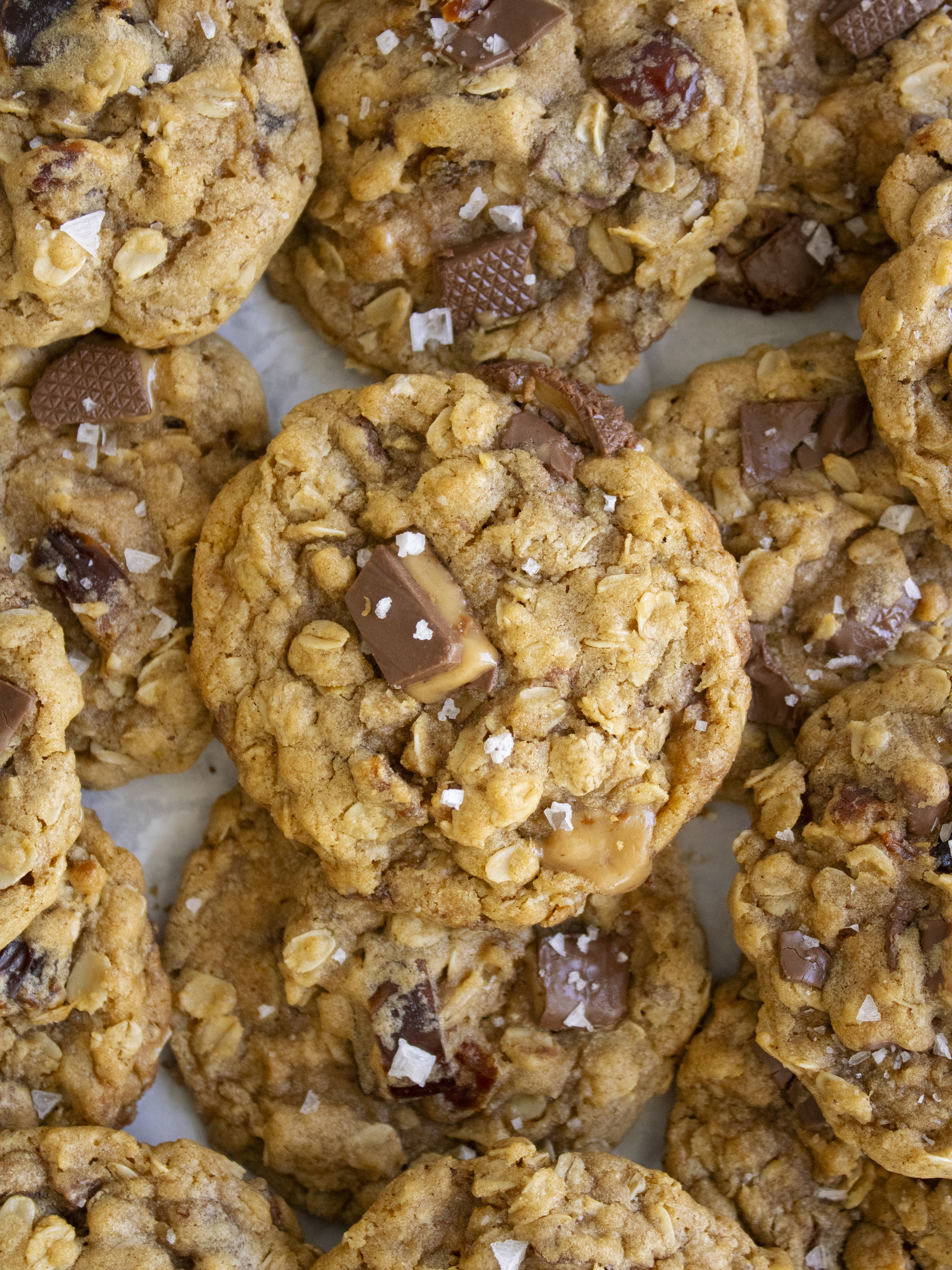 overhead shot of Salted Date and Toffee Oatmeal Cookies layered and stacked on top of each other