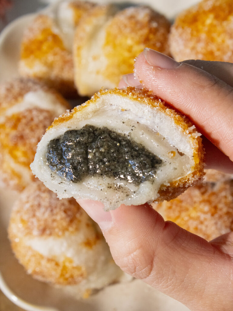 close up of the inside of Crispy Tangyuan with black sesame filling