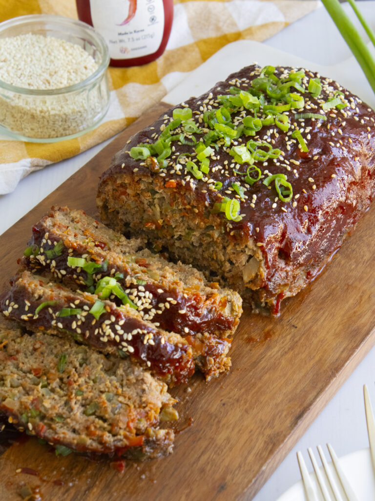 Gochujang Meatloaf sliced on a cutting board