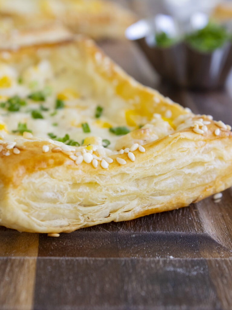 close up of puff pastry edge of Corn Cheese Puff Pastry Tarts