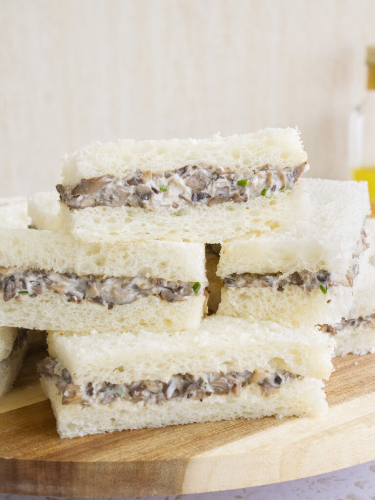 Truffle Mushroom Tea Sandwiches stacked on top of each other