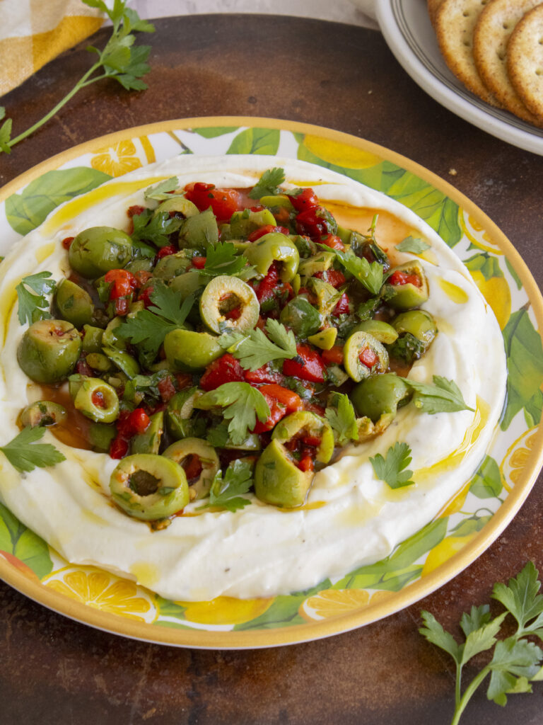 45 degree angle photo of Whipped Ricotta & Olive Dip
