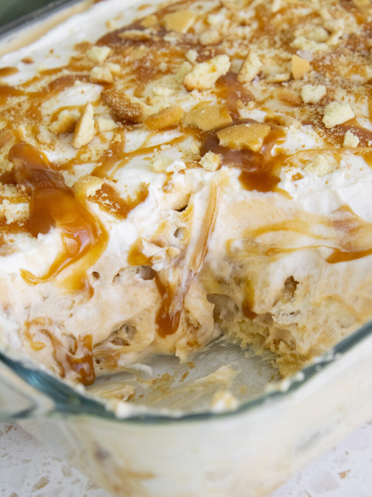 close up of Salted Miso Caramel Banana Pudding with scoop taken out of dish