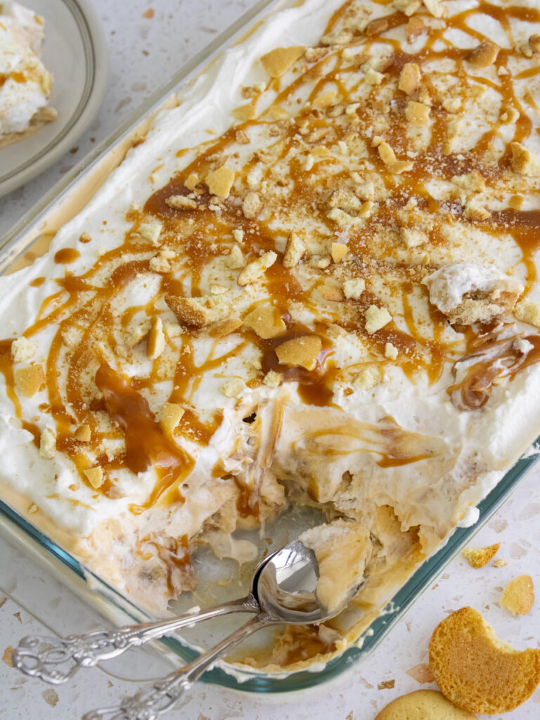 high angle of Salted Miso Caramel Banana Pudding in dish with scoops taken out