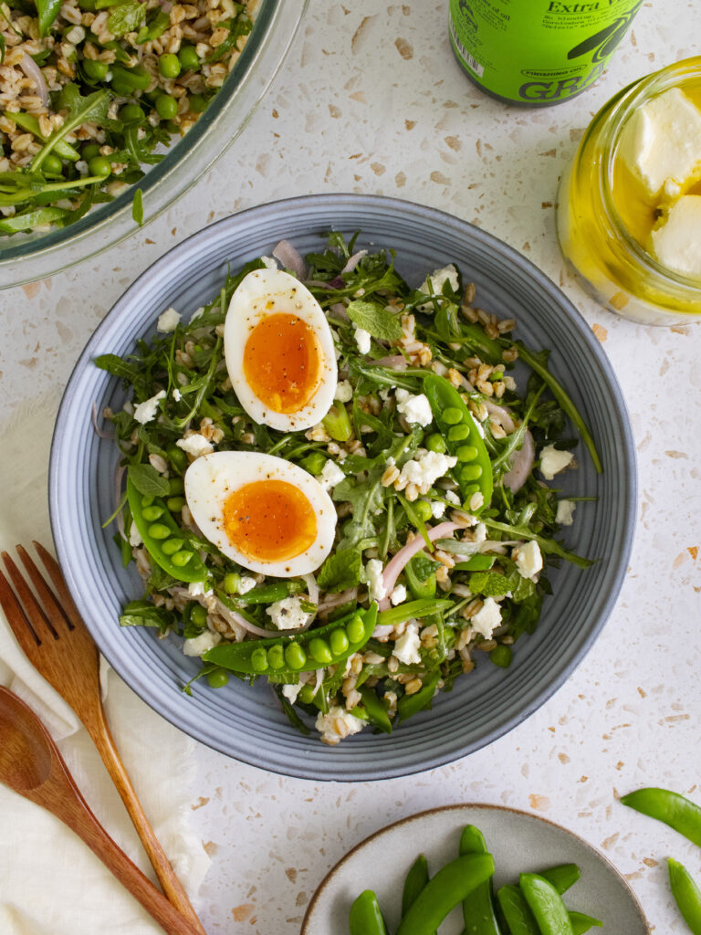 overhead photo of Spring Pea Farro Salad served in a dish