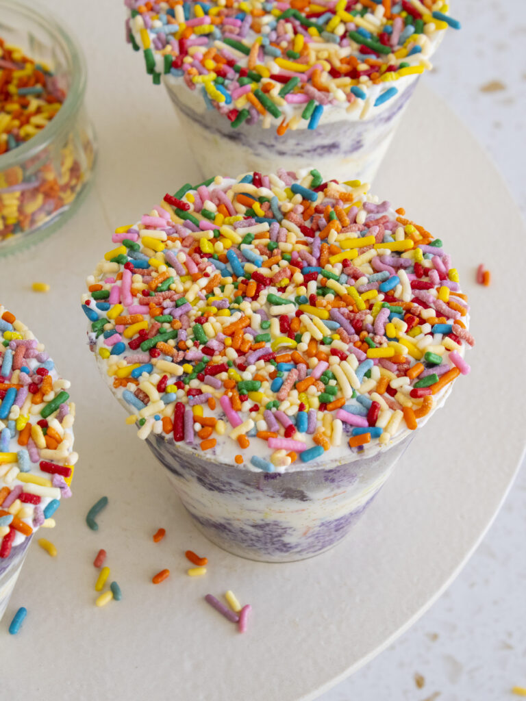 high angle of Ube Funfetti Dot Cake with focus on the sprinkle top