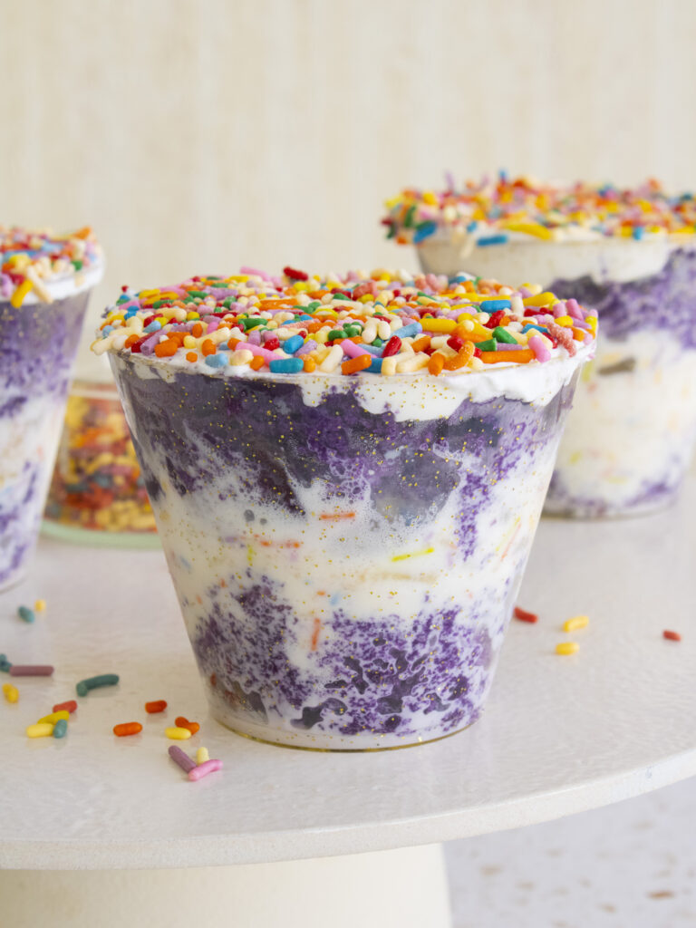 3 Ube Funfetti Dot Cake cakes on a cake stand