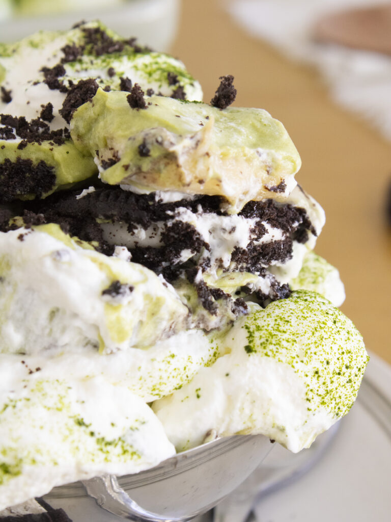 close up of Matcha Oreo Banana Pudding scooped in a cup