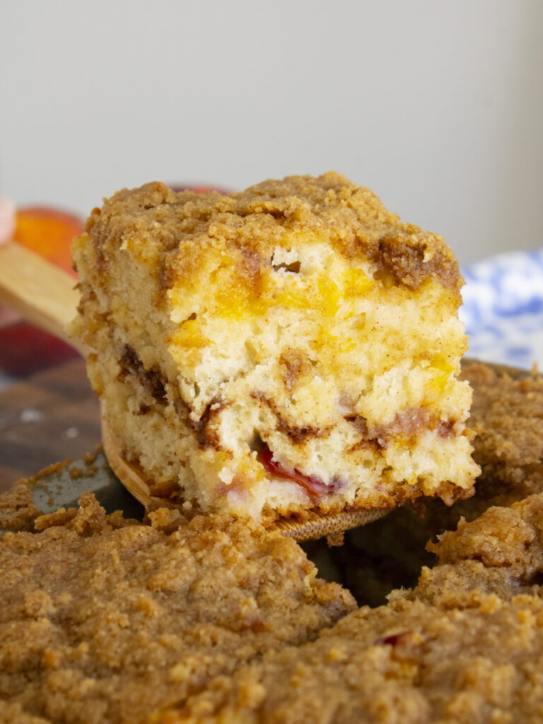 lifting Brown Sugar Peach Butter Swim Biscuits out of baking pan