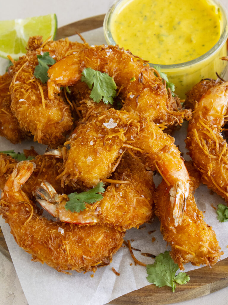 close up of Coconut Shrimp with Mango Habanero Aioli but main focus on shrimp