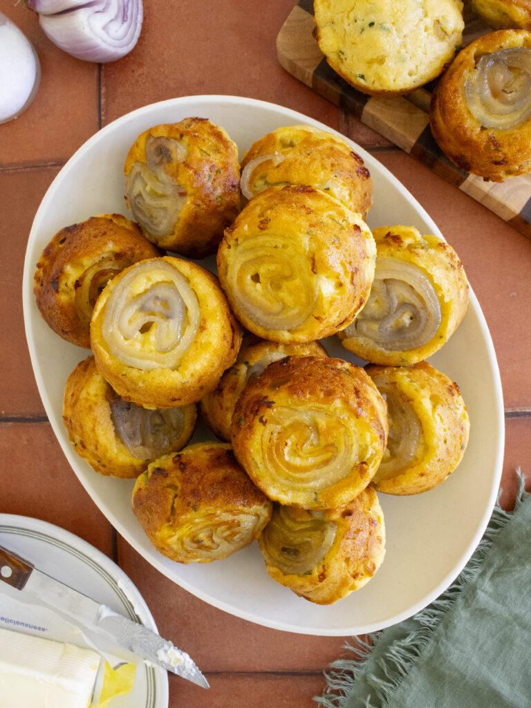 overhead photo of Upside-Down Shallot & Green Chile Cornbread stacked on a plate