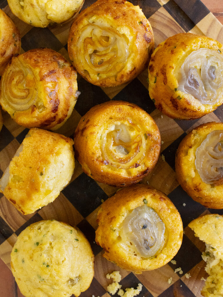 overhead photo of Upside-Down Shallot & Green Chile Cornbread laid out on a cutting board