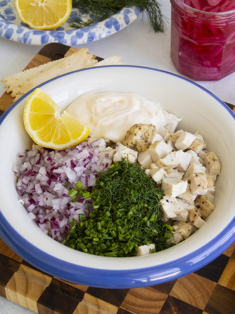 ingredients in a bowl to make Herby Chicken Salad